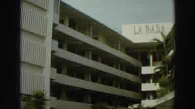 PUERTO RICO-1966: Multi-Story Building Sign Reads La Rada With Mountain View