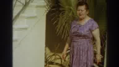 Puerto Rico (1966): Lady In Lilac Clothes Walks Beside The Beautiful Staircase And