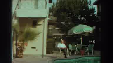 Puerto Rico (1966): Grandfather Reads A Book By The Pool