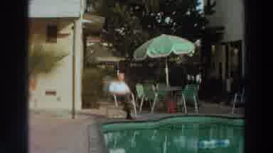 PUERTO RICO-1966: Mister Sitting By The Parasol In Front Of The Beautiful Pool