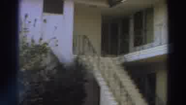 Puerto Rico (1966): A Woman In A House Look At Pool With Green Water And A