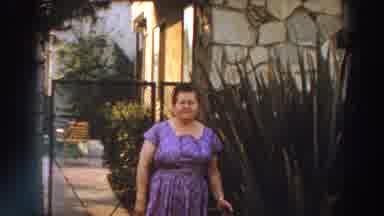 Puerto Rico (1966): A Woman Stands Besides The Flowers Close To A Building For A