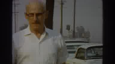 PUERTO RICO-1966: Man In White Shirt Walks Through Street And Beach