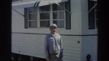Puerto Rico (1966): Man Wearing White Hat And Glasses Stands Near White Mobile