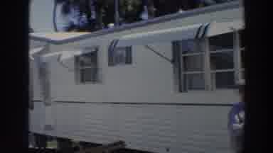 Puerto Rico (1966): A Camper Is Shown With A Man Smiling At The Entrance