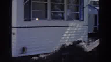 Puerto Rico (1966): View Of Dark Blue Car Parked Near Tan Mobile Home On A Clear