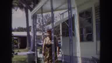 Puerto Rico (1966): A Woman Walking Away From Her House Towards The Camera Man