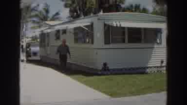 Puerto Rico (1966): Man Walking Alone And Examining The Perimeter of His Mobile