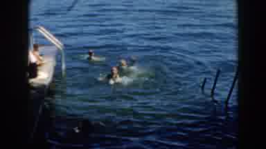 Brighton Michigan (1960): Three Men Swimming In The Water By A Concrete Dock