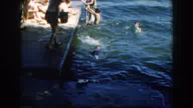 Brighton Michigan (1960): People Swimming And Having Fun In The River As Others
