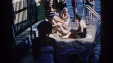 Brighton Michigan (1960): Women Relaxing On A Concrete Balcony Bordering A Lake