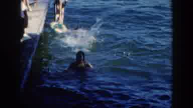 Brighton Michigan (1960): The Woman And Man Swimming Floating And Having Fun And