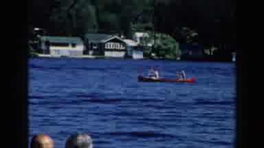 Brighton Michigan (1960): People In A Canoe Paddle It In The Middle Of A Lake