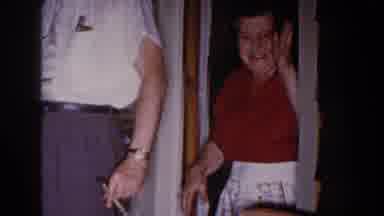 Brighton Michigan (1960): Men Cheer And Excitedly Shake The Hand Of A Woman In A