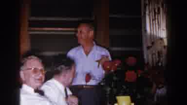 Brighton Michigan (1960): Man Wearing White Shirt And Glasses Prepares To Smoke