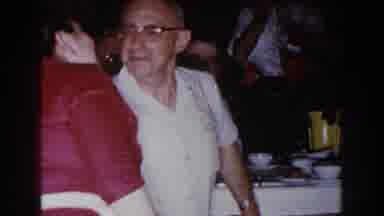 Brighton Michigan (1960): Old Man Kissing His Wife During A Party With Relatives
