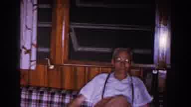 Brighton Michigan (1960): An Old Man And Woman In A Home Sitting And Getting Up
