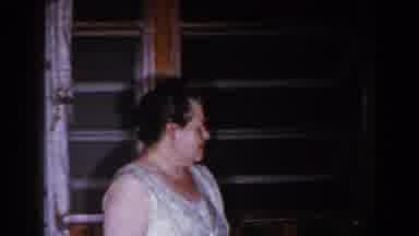 Brighton Michigan (1960): An Old Mother Picks An Object From The Living Room