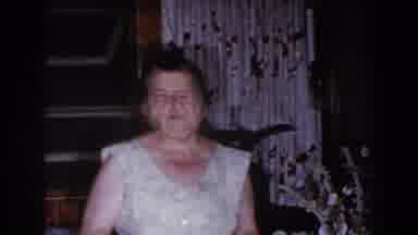 Brighton Michigan (1960): Woman And Man Wearing White Shirts Walk Towards Camera