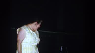 Brighton Michigan (1960): Old Woman Checking And Flicking Her Purple And Pink
