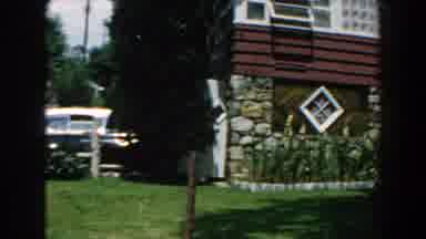 Brighton Michigan (1960): Picture Of A Residence With Beautiful Flower Garden On A