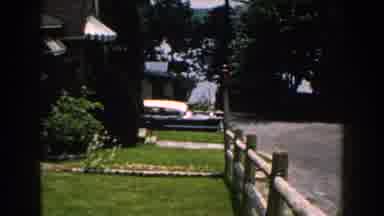 Brighton Michigan (1960): A Woman Stands Beside Her Car To Look Up At The Rocky