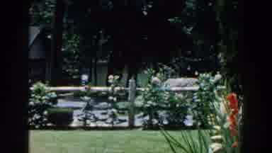 Brighton Michigan (1960): Highly Structured Landscaping And Beautiful Flower