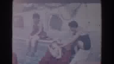 North Hollywood California (1961): Young Boy Jumps From A Floating Raft Into The