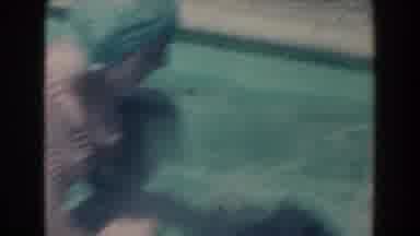 North Hollywood California (1961): A Mum Plays With Her Son In The Pool As Other