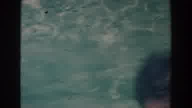 North Hollywood California (1961): Kid Swimming Happily With His Mom