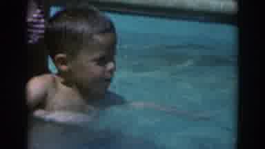 North Hollywood California (1961): A Woman Swims With Her Son And Helps Him Out Of