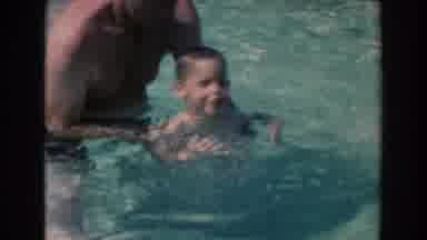North Hollywood California (1961): Man Helps Little Boy To Attempt To Swim Camera
