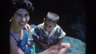 North Hollywood California (1961): A Woman Lifts Her Son To Her Audience During A