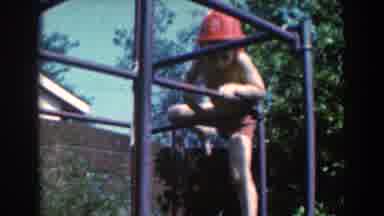 North Hollywood California (1961): Little Shirtless Kid Hanging On Bars Alone