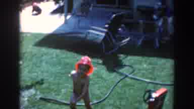North Hollywood California (1961): Young Boy In His Fireman's Cap Playing And