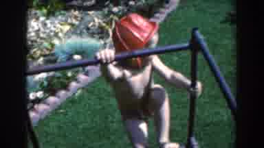 North Hollywood California (1961): A Boy Climbing In A Toy With A Firefighter Hat