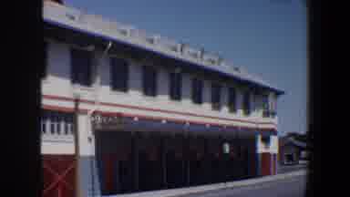 Saint Louis Missouri (1964): Vehicles Moving Around In Front Of A Large Building