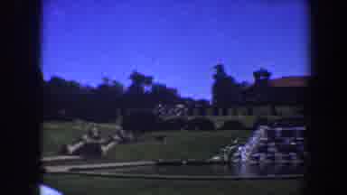 Saint Louis Missouri (1964): View Of Brown Building Green Grass And Grey