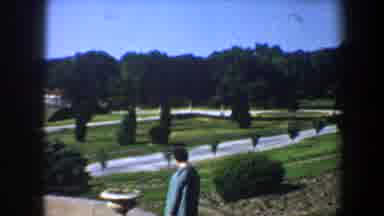 Saint Louis Missouri (1964): A Woman In A Blue Jacket Walks Steadily Down The