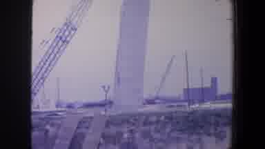 Saint Louis Missouri (1964): View Of Steel Crane And Towering White Object On A