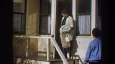 Wyoming-1957: Women Leaving House With Bags In 1950s Americana Scene