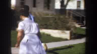 Wyoming (1957): A Man And A Woman Run After A Dog In The Compound