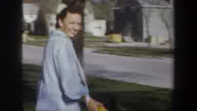 Wyoming (1957): Several People Standing Around A Man On A Residential Street Who