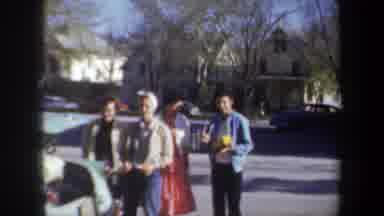 Wyoming (1957): Man Wearing Blue Sweater Waves At Camera On A Sunny Day