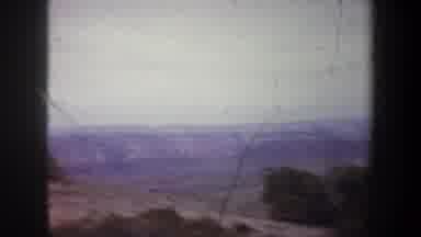 Wyoming (1957): Aerial Viewing Of Mountains Valleys And Buildings Of A Town From A