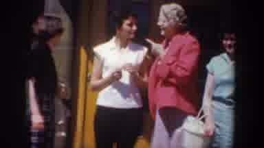 Wyoming (1957): Women With Colorful Clothes Smiling In A House