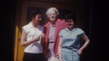 Wyoming (1957): Four Women Stand In Front Of Brown Door On A Bright Sunny Day