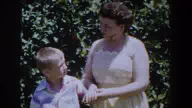 Lubbock Texas (1953): Retro Video Of Dressed Mother Holding Hands And Talking With