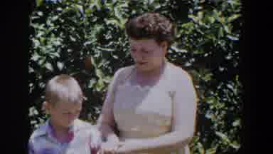 Lubbock Texas (1953): Woman Wearing Beautiful Dress Plays With Cute Blonde Boy