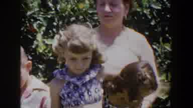 Lubbock Texas (1953): A Lady Sitting Next To A Tree With Two Girls And A Small Boy